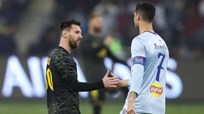 Lionel Messi greeting Cristiano Ronaldo